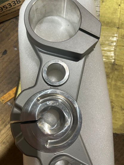 BMW F800GS triple clamp angled view highlighting fork pinch bolts and clamp surface
