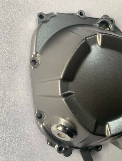 Z800 clutch cover close-up showing bolt holes and gasket surface, clean refurbished aluminum OEM part