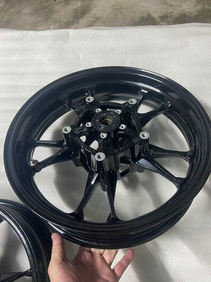 BMW C400X front wheel rim, close-up of hub center and axle bore detail, no cracks visible