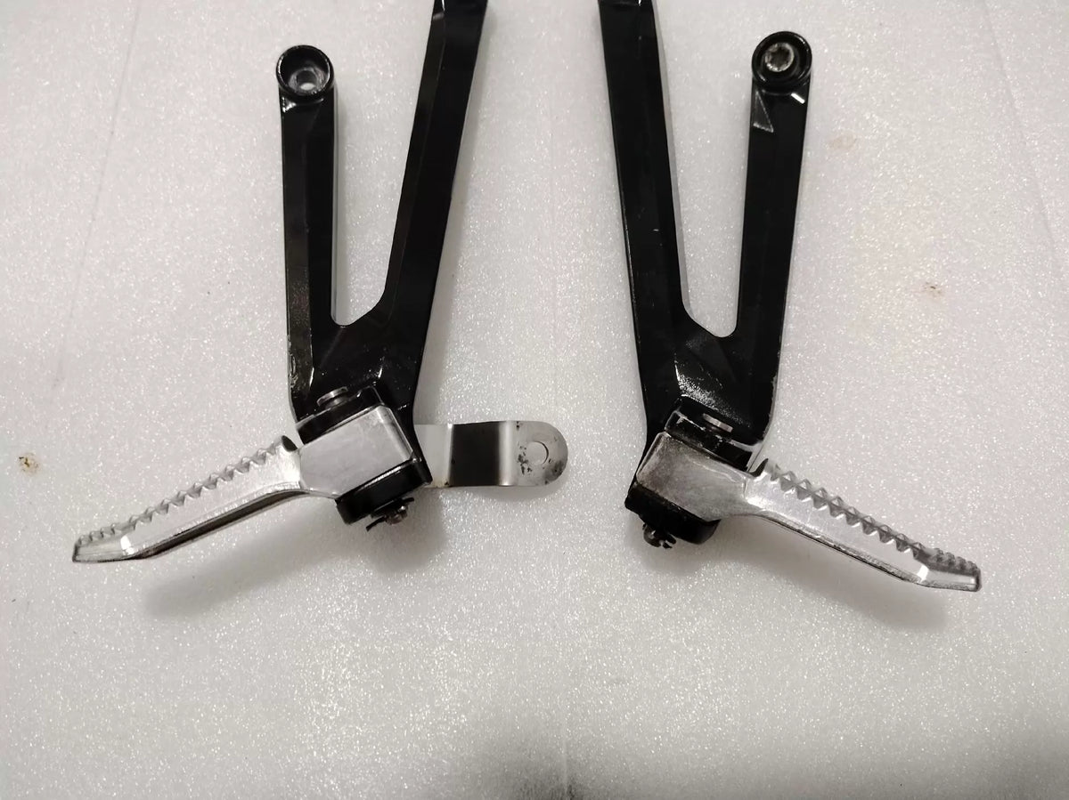 BMW S1000RR footpeg bracket, rear angle detail showing weld quality and bracket thickness