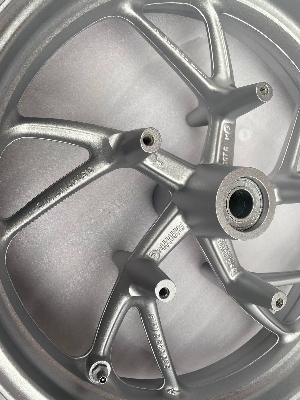 BMW K1600GT front rim, close-up of hub center and bearing area, no visible damage or cracks