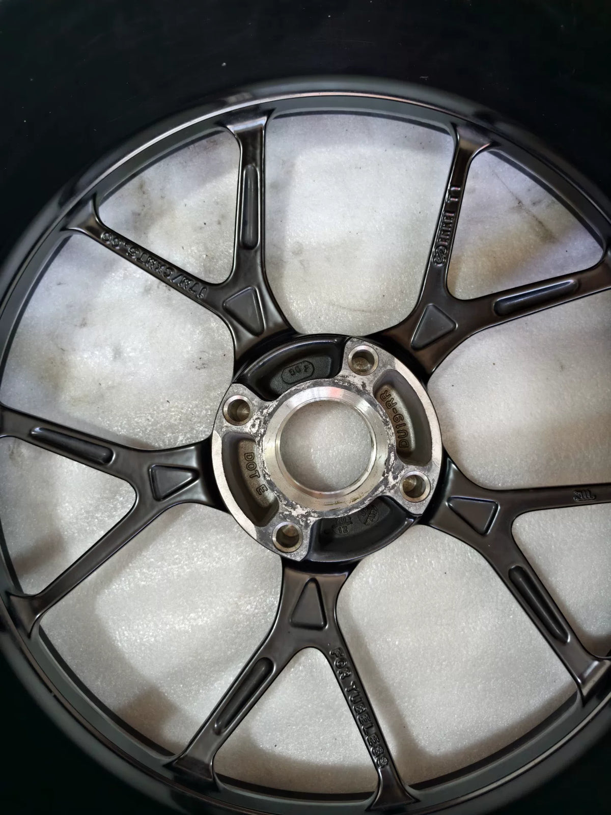 Ducati Panigale V2 rear wheel, close-up of hub center and bearing area, wear visible