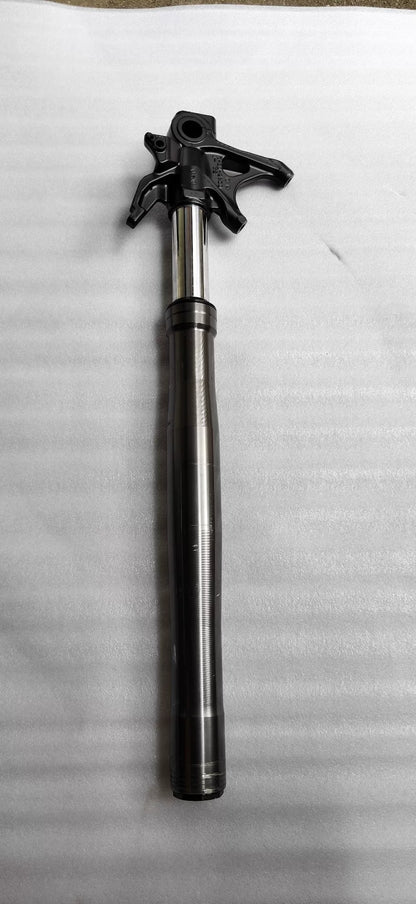 Ducati Panigale V2 front fork, close-up of upper chrome tube and dust seal, surface detail visible