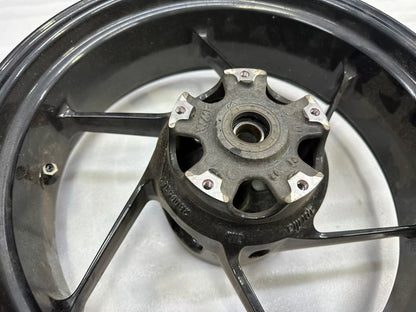 OEM Aprilia RS660 rear wheel 5.5x17 close-up of hub center and brake disc mounting flange