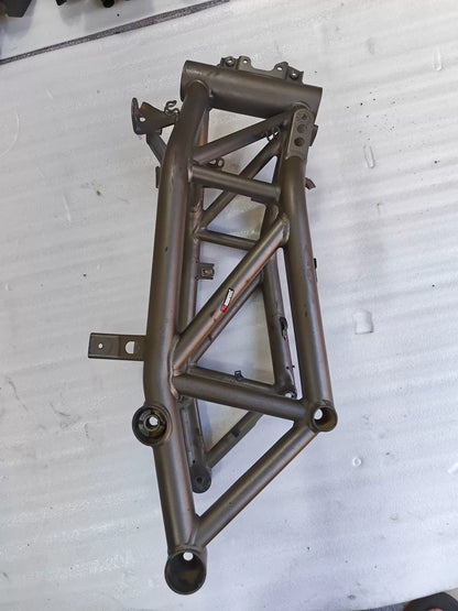 Angled side view of grey trellis frame for Ducati MTS1200, Akrapovic sticker, pivot bearing seats, used