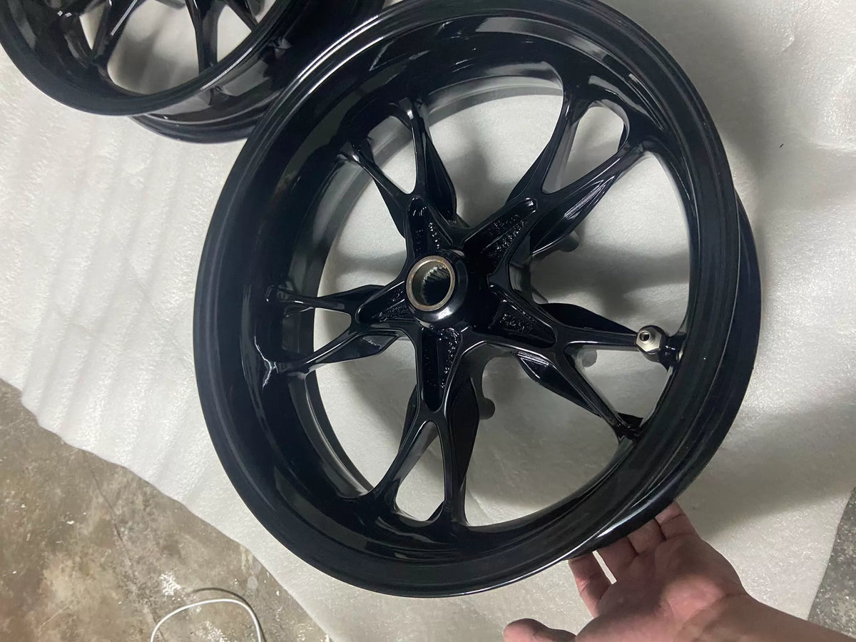 BMW C400X front wheel rim, reverse side view showing spoke welds and inner rim channel