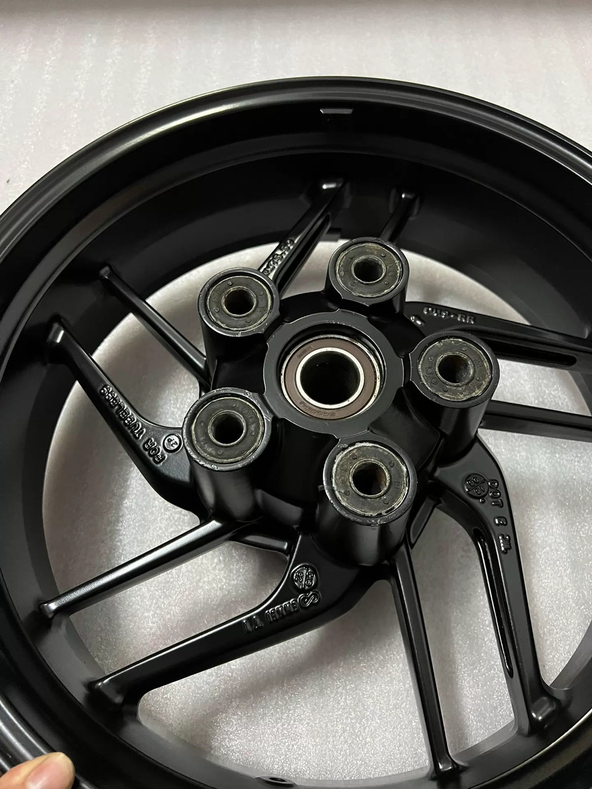 Ducati Monster 821 2014-2020 rear wheel, angled view highlighting spoke pattern and rim edge