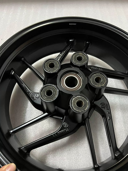 Ducati Monster 821 2014-2020 rear wheel, angled view highlighting spoke pattern and rim edge