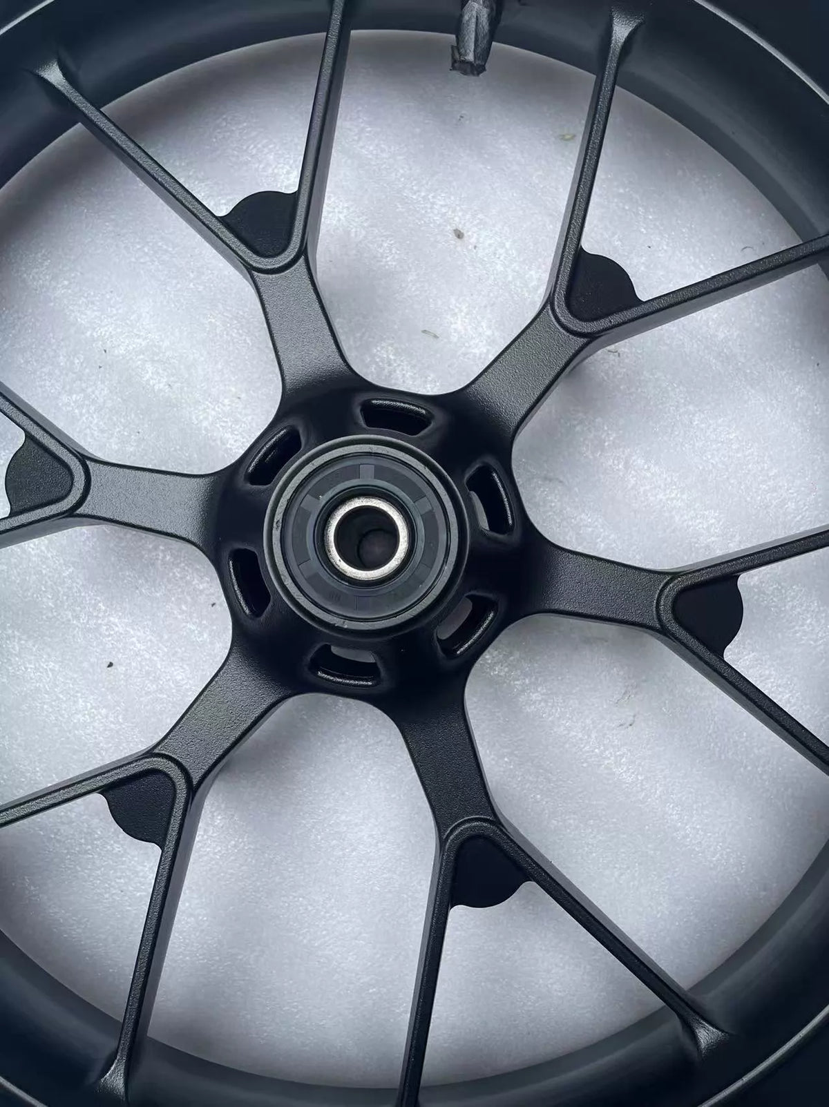 Honda CBR 500R front wheel rim straight, rear face view showing brake disc mounting holes