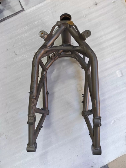 Front view of grey trellis frame for Ducati MTS1200, steering head, twin front downtubes, bare used metal