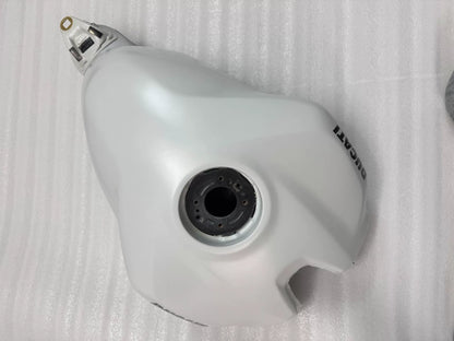 White fuel tank for Ducati Panigale V2, underside view exposing mounting brackets and fuel inlet port
