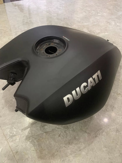 Matte black fuel tank for Ducati XDiavel S, rear angle view showing mounting brackets and overall condition
