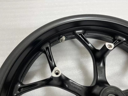 Honda NC750X rear rim angled view showing spoke pattern and hub flange, silver alloy wheel