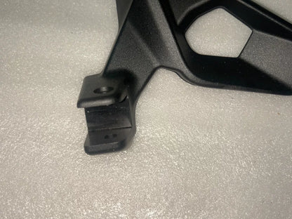 BMW S1000XR footpeg bracket, close-up of mounting plate and threaded hole positions