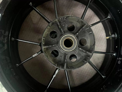 Close-up of BMW S1000RR rear rim hub and spoke junction, silver finish
