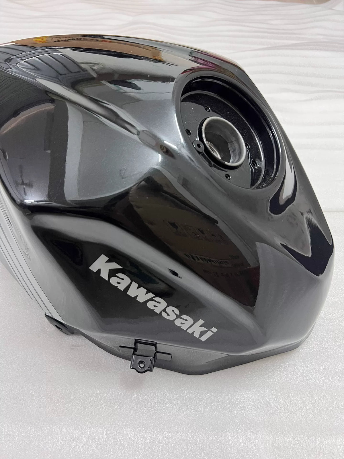 Kawasaki Ninja 400 fuel tank right side angle showing full body contour and surface condition