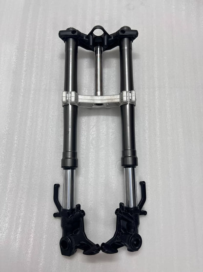Ninja 1000SX front fork tubes close-up showing chrome stanchions and upper triple clamp detail