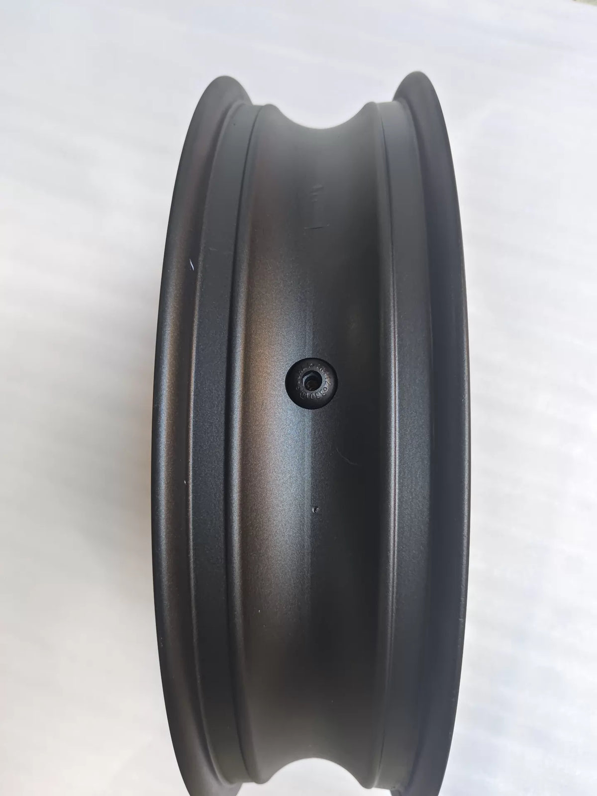 Angled overhead view of CBR 500R front wheel rim showing spoke layout and center hub construction