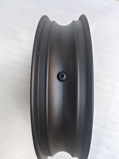 Angled overhead view of CBR 500R front wheel rim showing spoke layout and center hub construction
