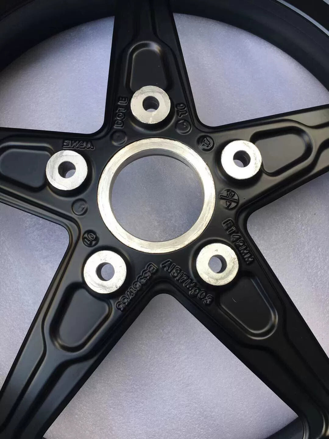 BMW R nineT rear cast rim, close-up of hub and axle mounting area showing machined finish
