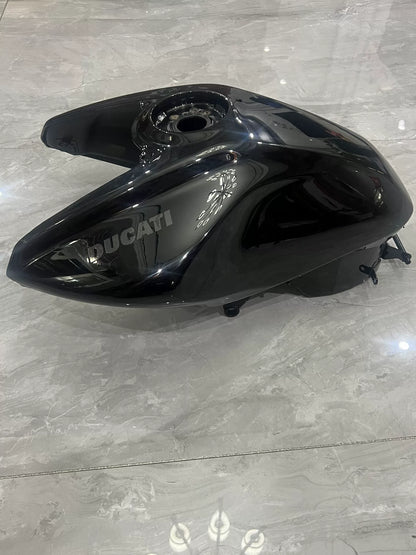 Ducati Diavel V4 black fuel tank close-up showing surface quality and logo area detail