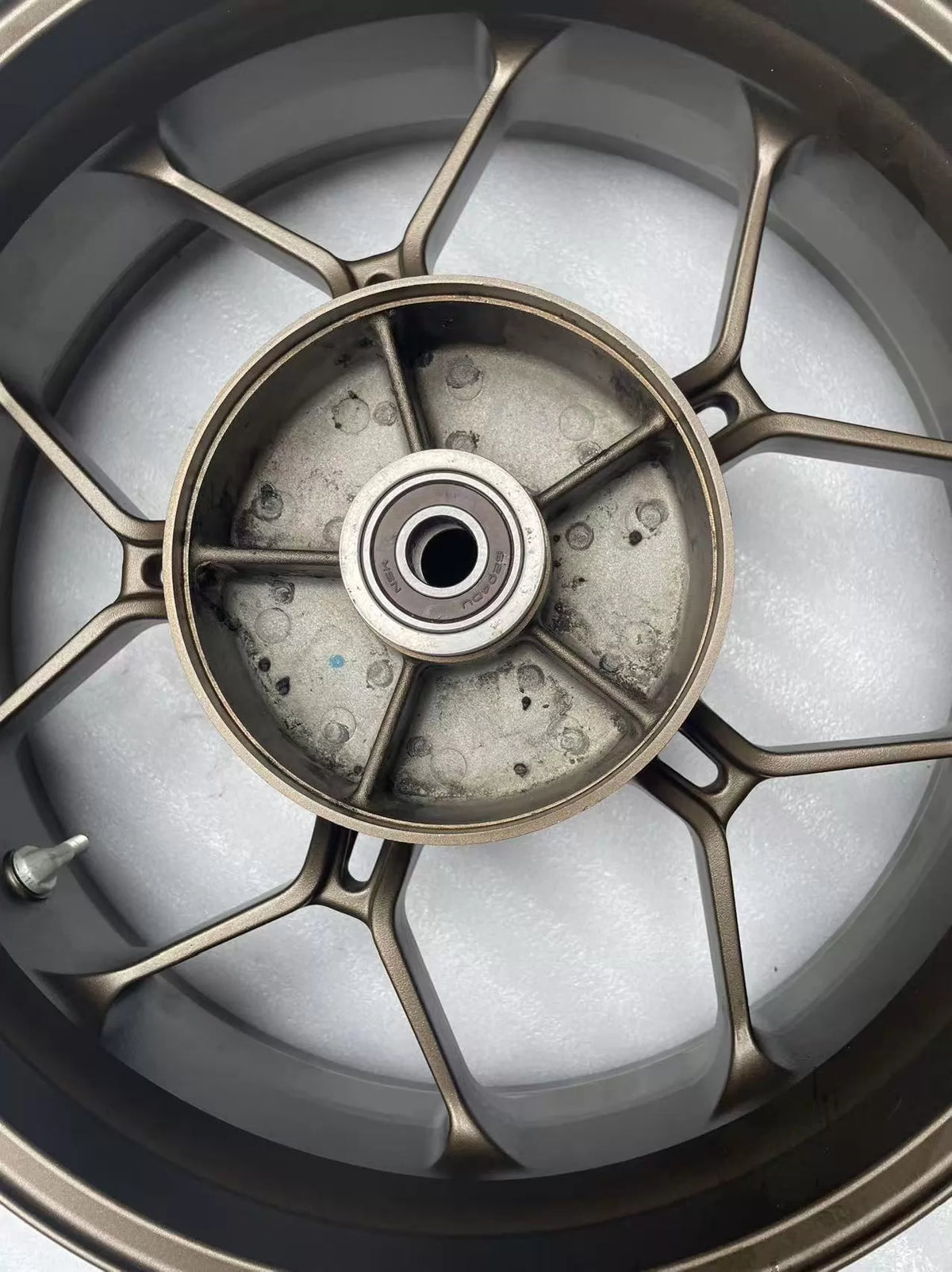 Rear rim for Honda CBR 650R 2019-2023, close-up of hub center and axle area showing bearing housing