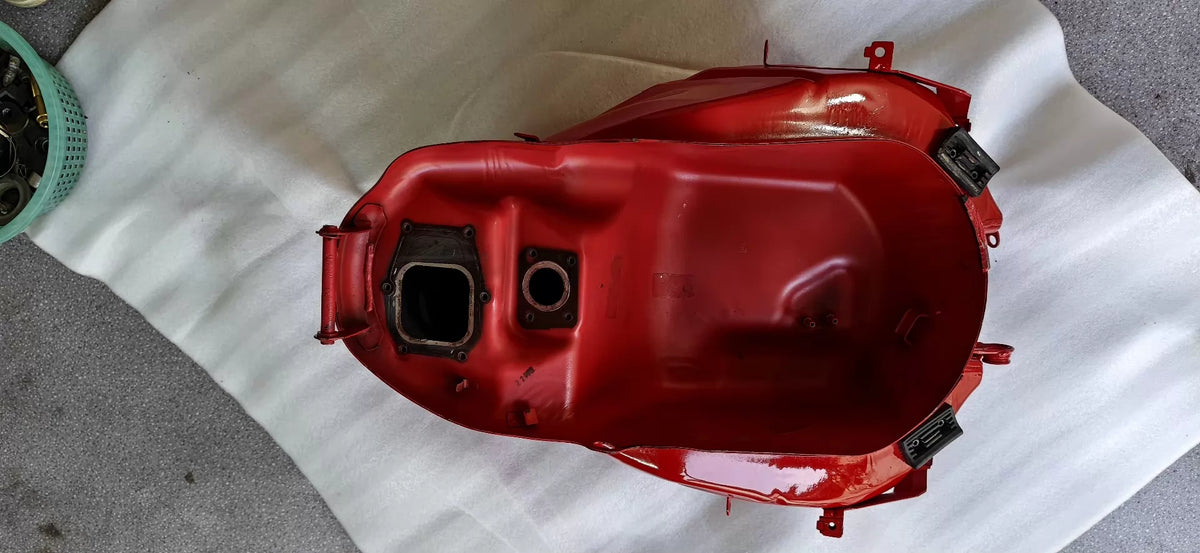 Red fuel tank for Ducati SuperSport 939, right side profile showing curves and painted bodywork detail