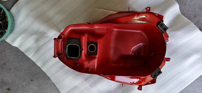 Red fuel tank for Ducati SuperSport 939, right side profile showing curves and painted bodywork detail