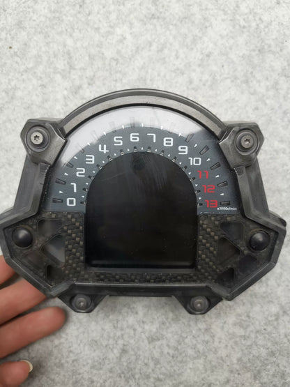 Kawasaki Z900 instrument cluster side angle view showing housing depth and condition
