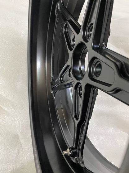 BMW R nineT cast rim, three-quarter angle showing rim depth and polished lip edge