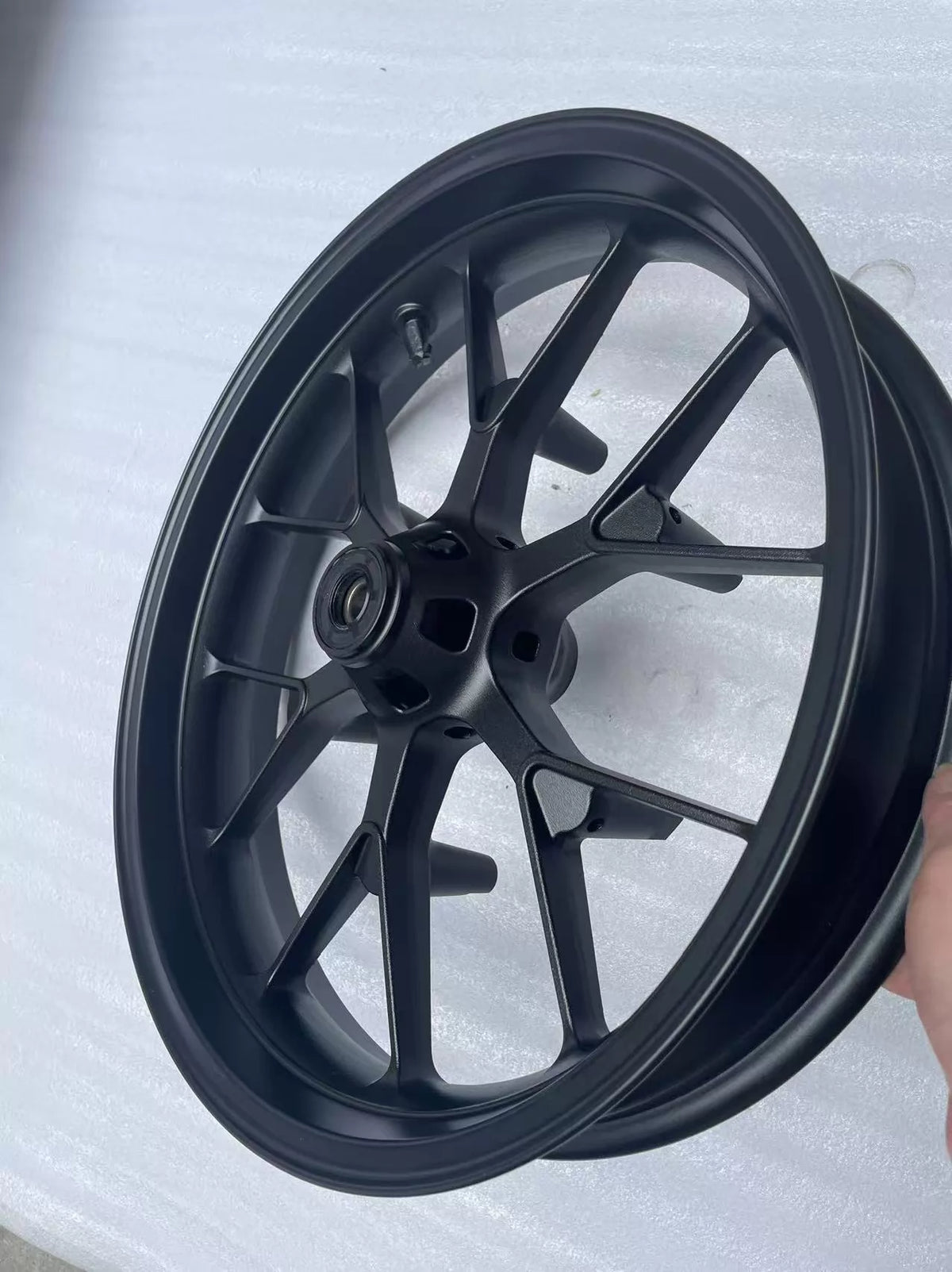 Honda CBR 500R front wheel rim straight, angled view showing outer rim edge and spoke detail