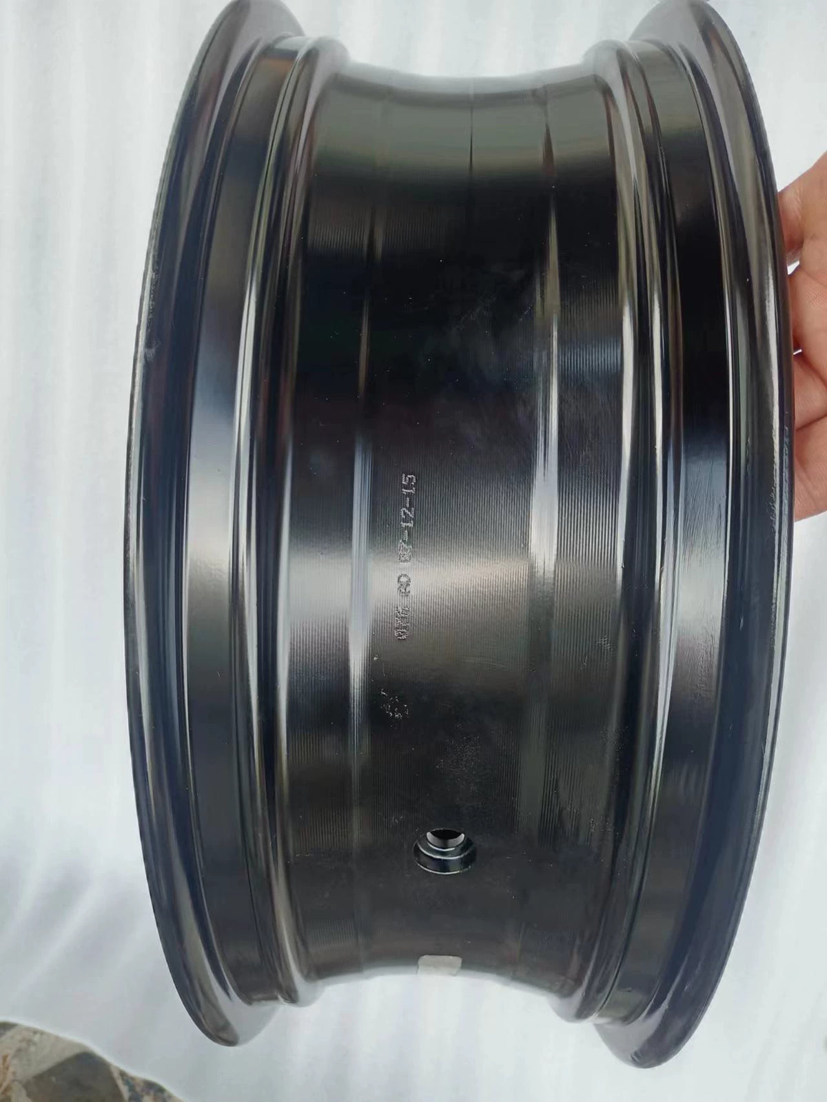 Rear wheel assembly gloss black Kawasaki Z800, angled view highlighting spoke pattern and rim finish