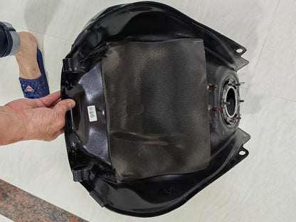 Honda CB650R fuel tank underside view displaying brackets and fittings