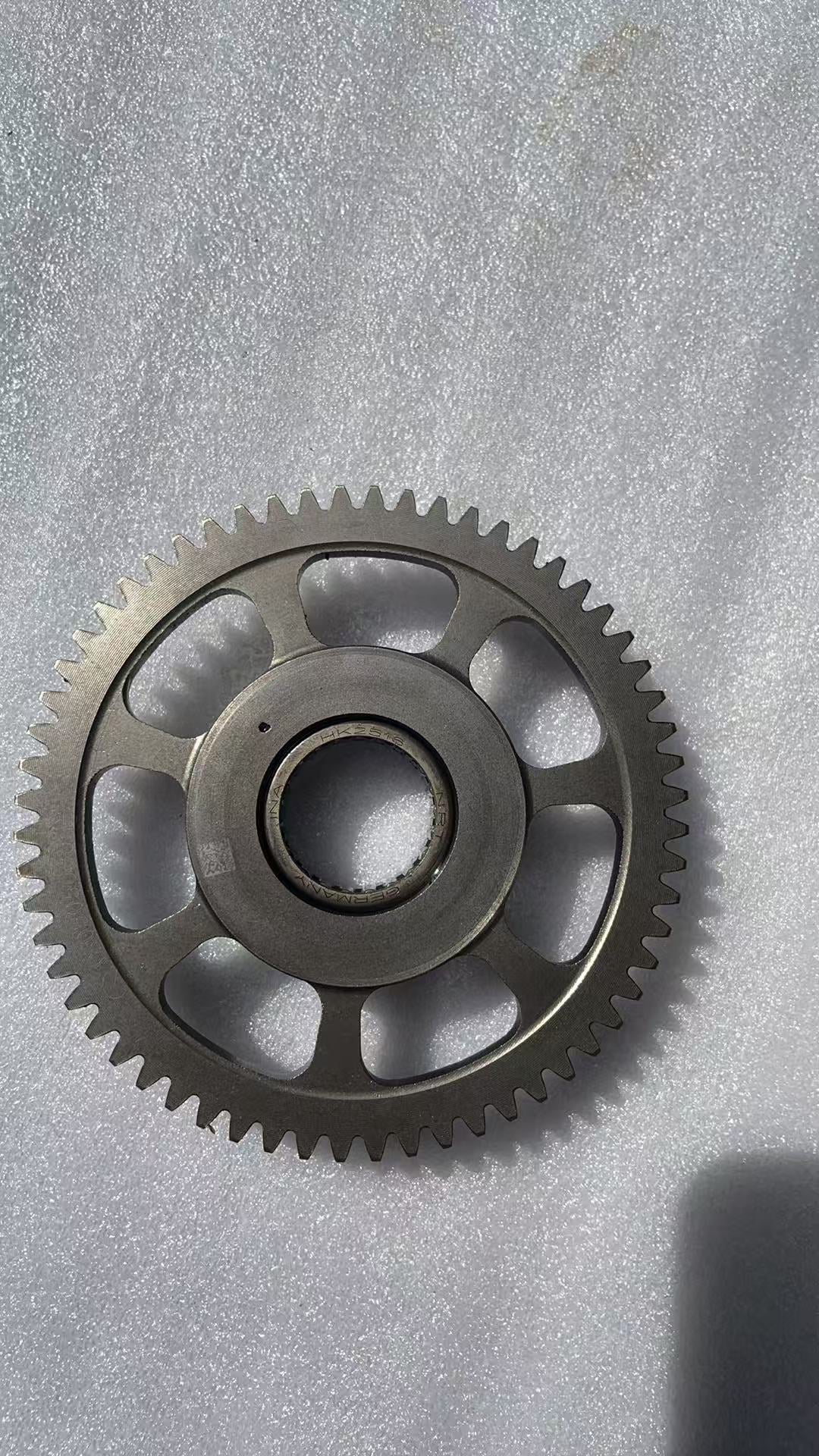BMW G310R flywheel laid flat showing full disc diameter and center bore detail
