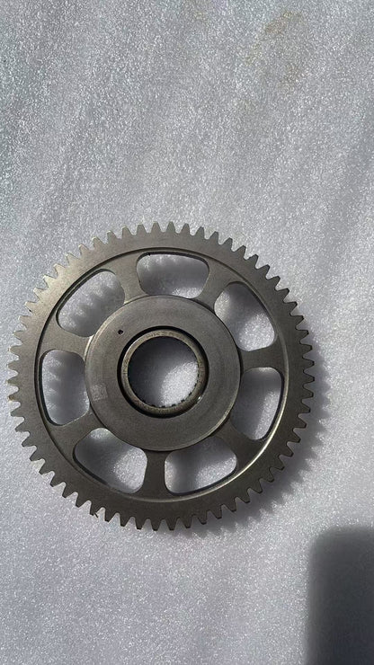 BMW G310R flywheel laid flat showing full disc diameter and center bore detail