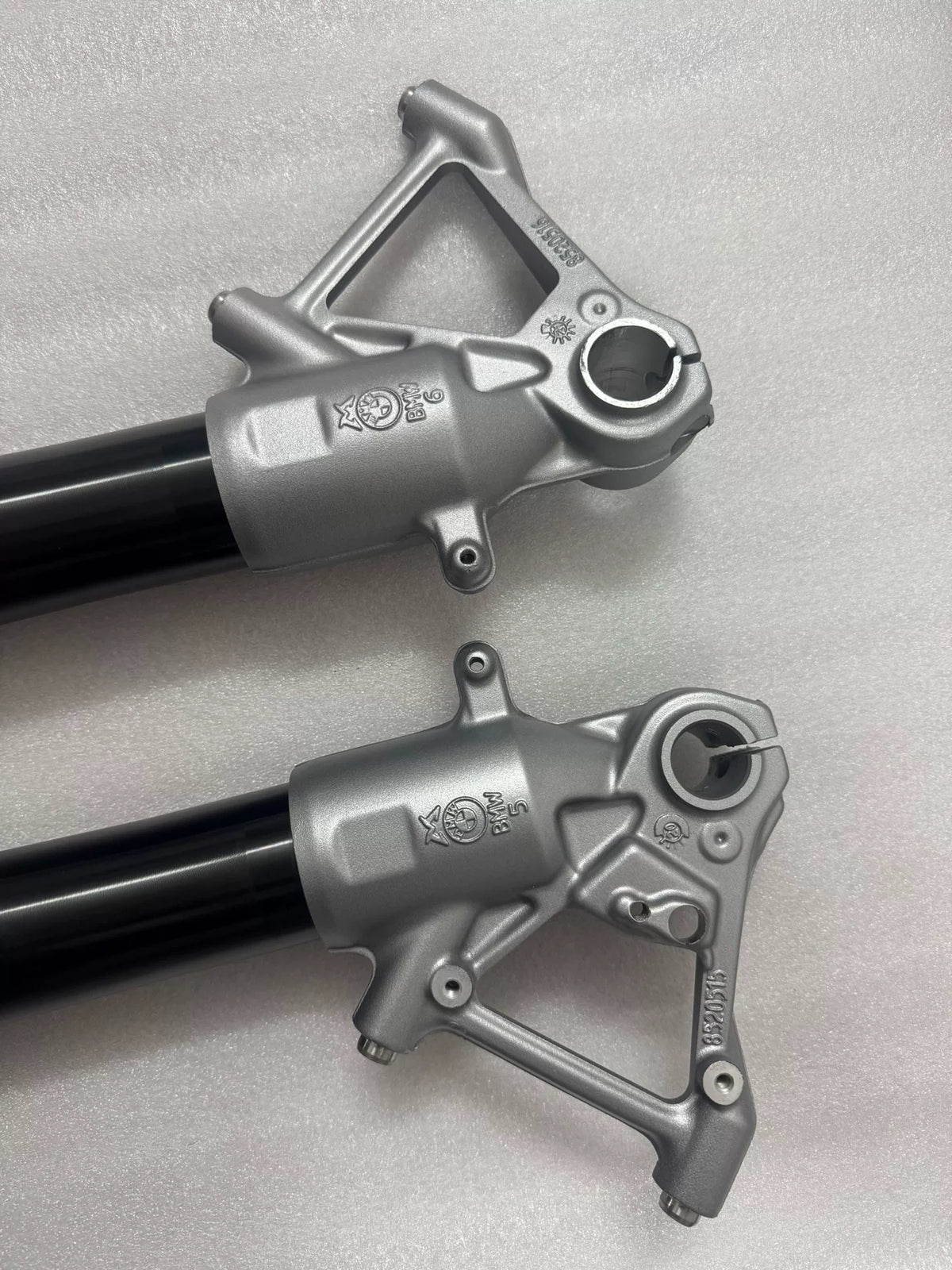 BMW R1200GS fork rod, close-up of lower end tip detail, precision machined finish visible