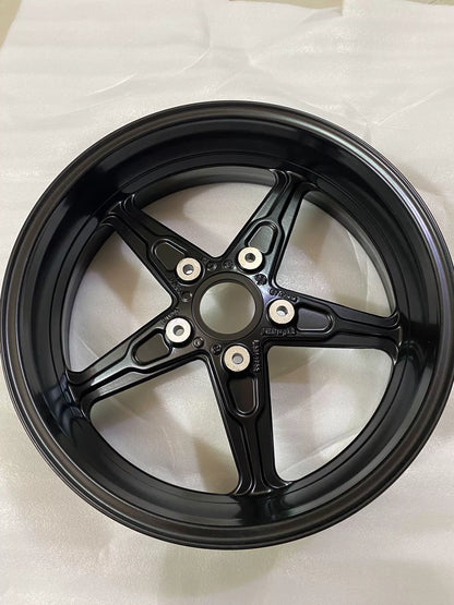 BMW R nineT front cast rim lateral view, full wheel profile with valve stem hole visible