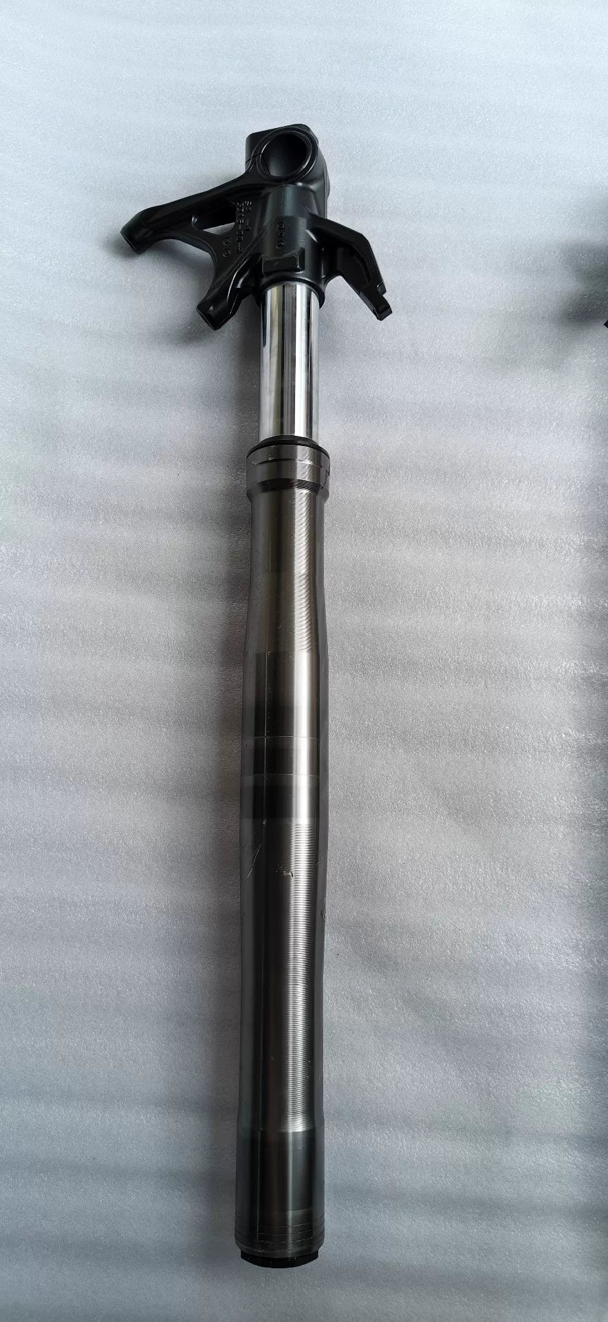 Ducati Panigale V2 front fork pair, rear view showing rebound adjuster and preload settings