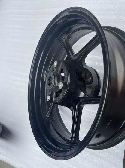 Kawasaki ZX-6R rear wheel rim WHEEL-ASSY gloss black, side profile view showing spokes and hub detail