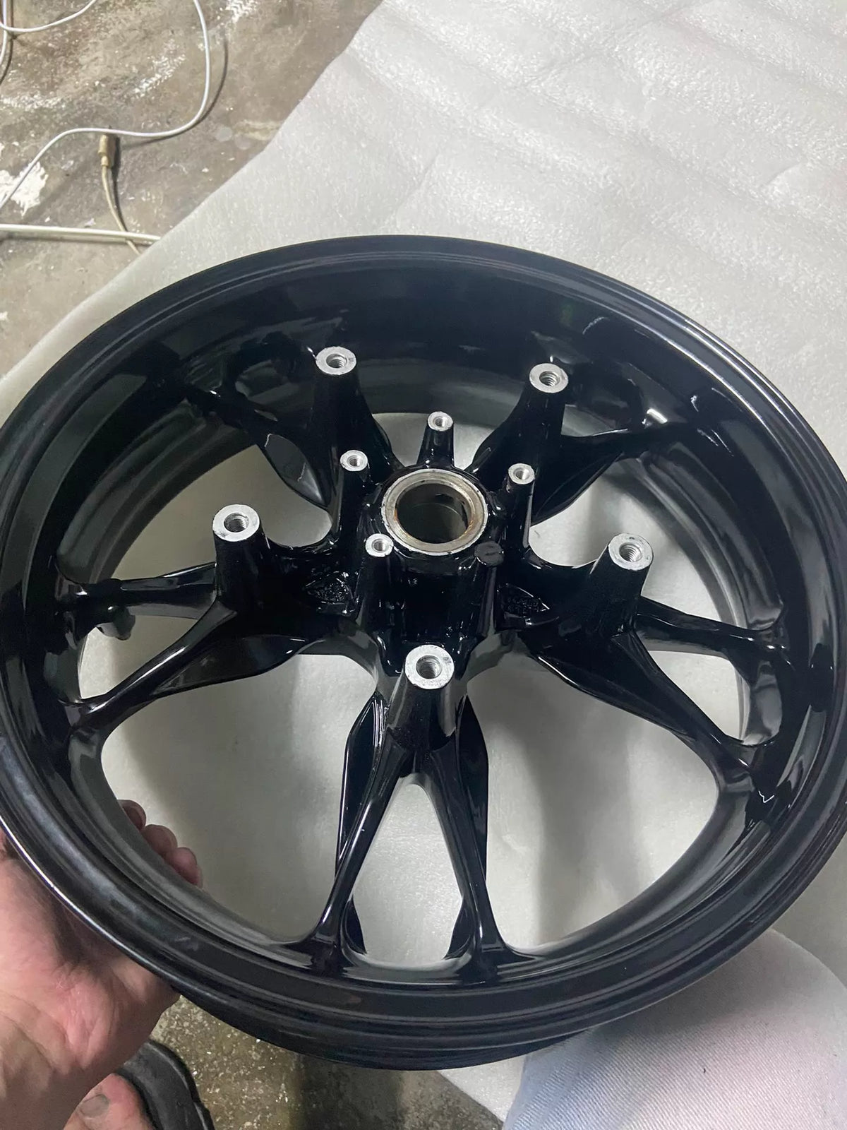 BMW C400X rear wheel rim, side profile showing rim lip and overall straight undamaged condition