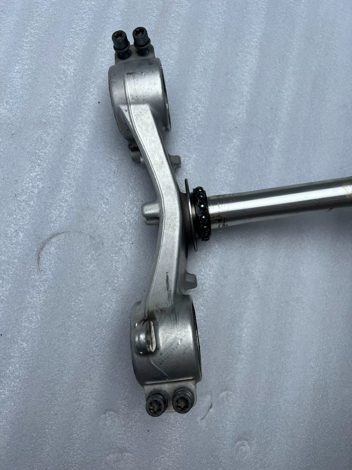 BMW S1000RR triple clamp side profile view highlighting stem length and overall clamp thickness