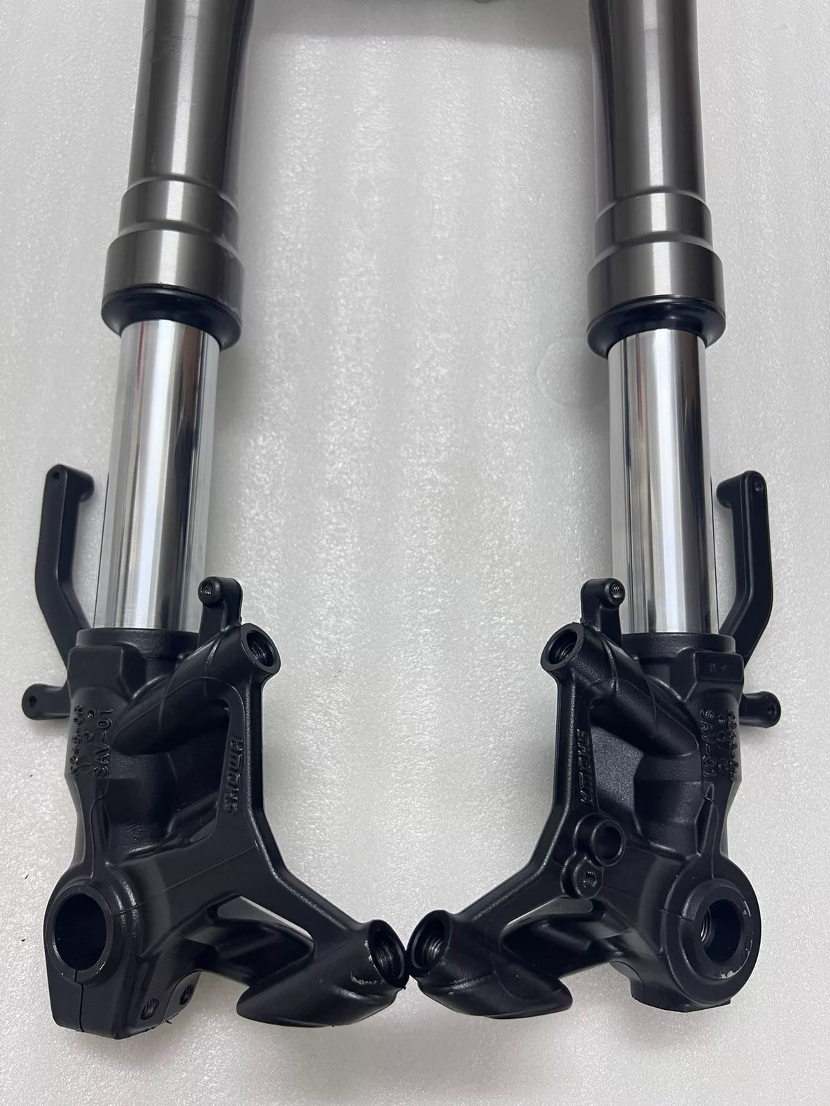 Front fork lower legs and axle clamps detail, Kawasaki Ninja 1000SX, side angle view