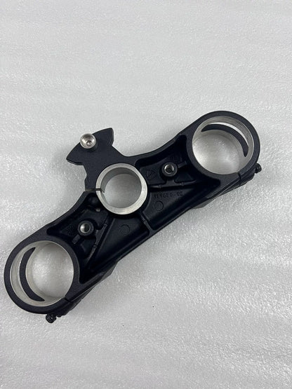 Lower fork yoke Ducati Multistrada 1200, top angle showing fork tube clamps and machined finish
