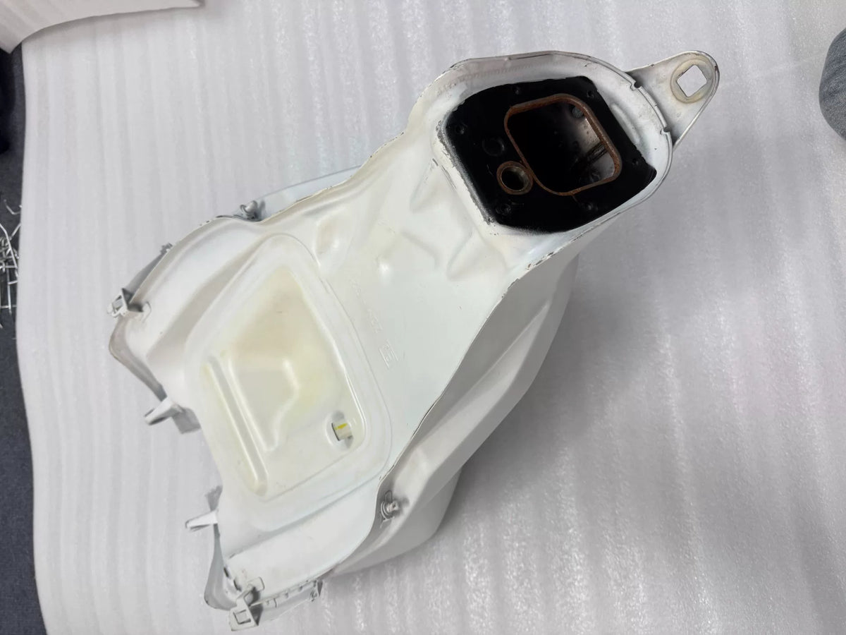 White Ducati Panigale V2 tank right-side profile view displaying overall shape and glossy white finish