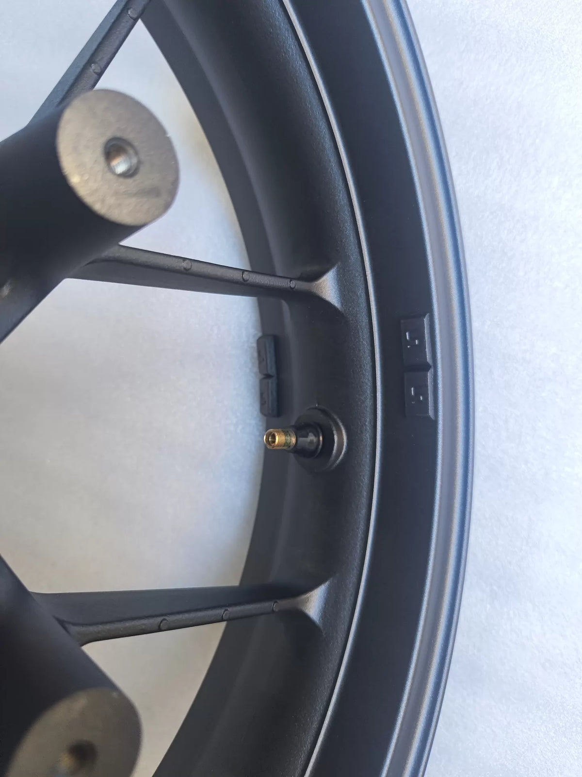Honda CBR 500R front wheel rim side profile view highlighting rim width and brake disc mounting holes