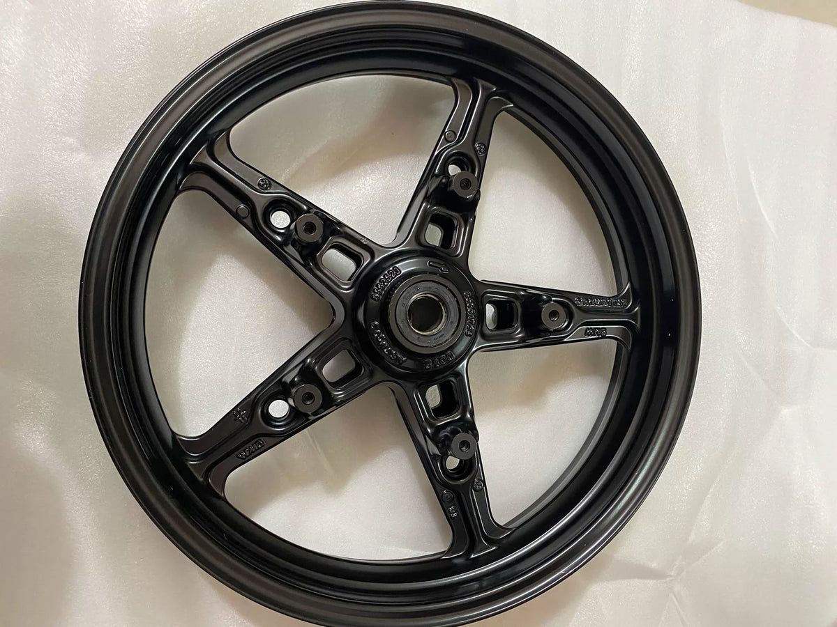 BMW R nineT cast rear rim, inner spoke surface detail showing casting texture and finish
