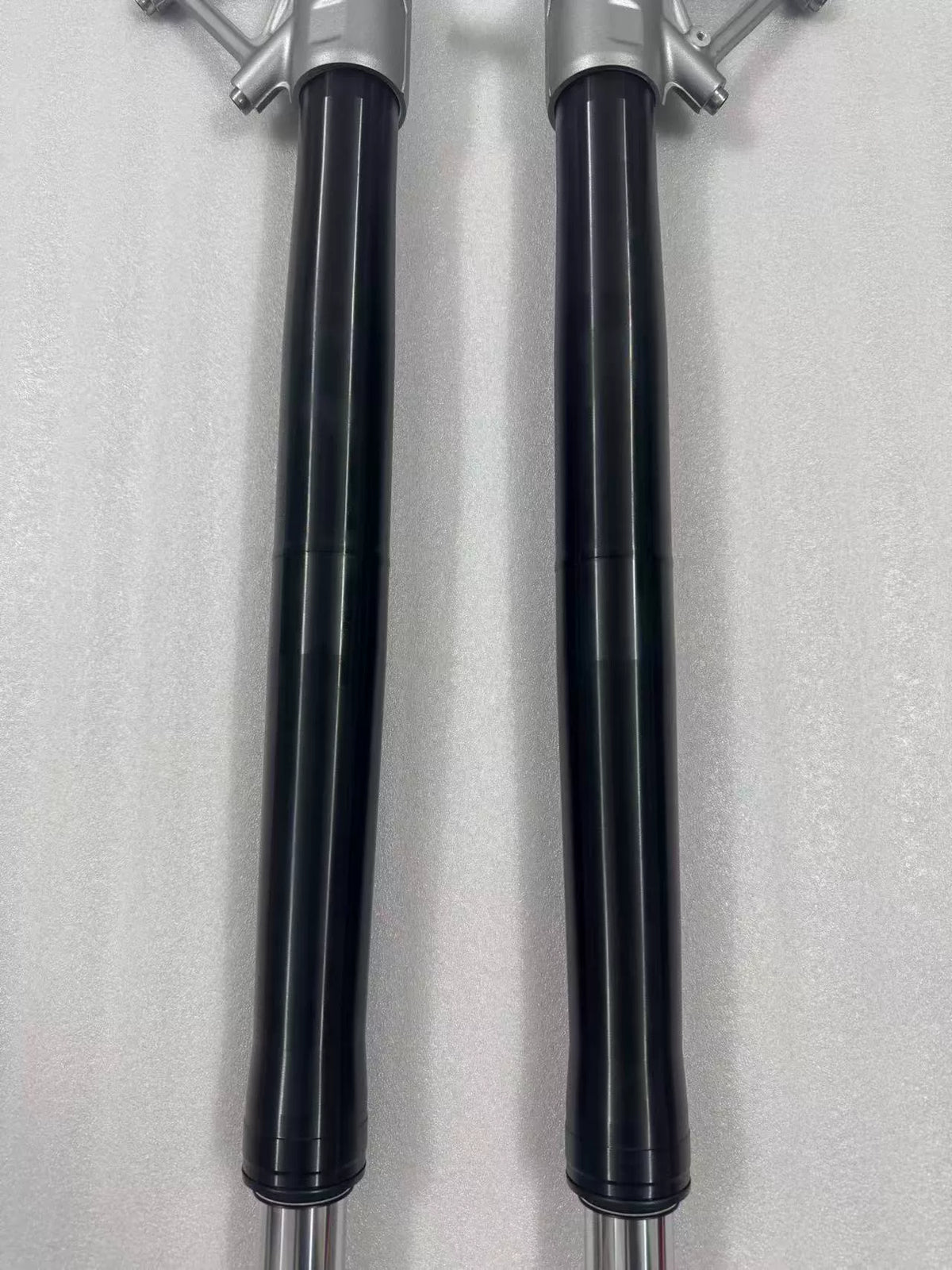 BMW R1200GS front fork rod close-up mid-section, smooth polished shaft surface detail shown