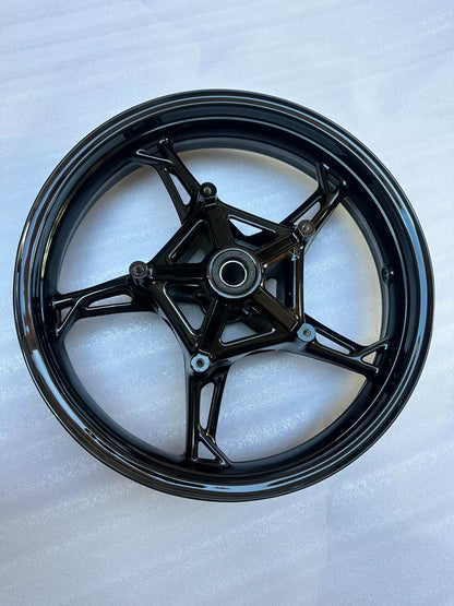 BMW S1000RR front wheel brake disc rotor mount showing bolt holes and rotor carrier