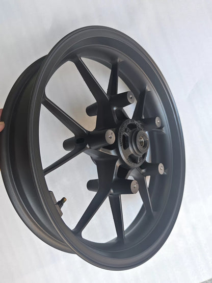 Close-up of Honda CBR 500R front rim inner hub and bearing seat area showing machined aluminum finish