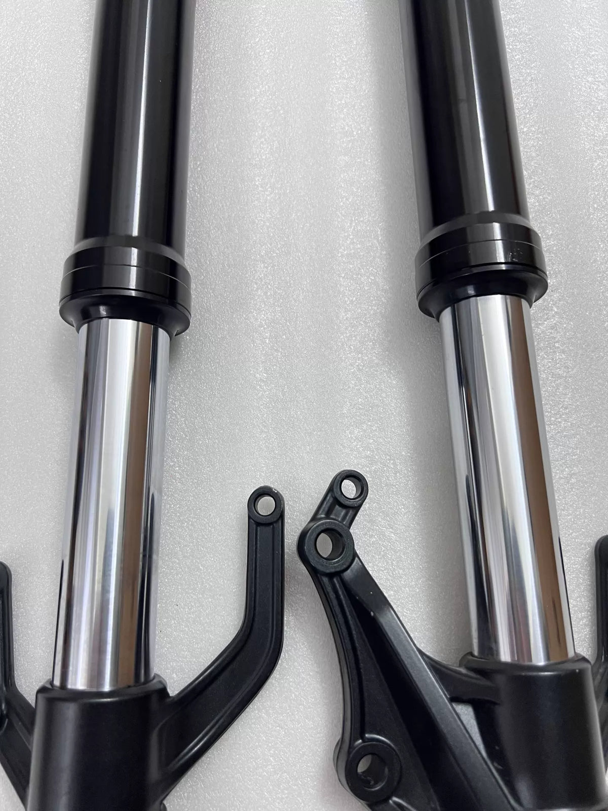 Yamaha YZF-R3 front fork assembly, side angle view showing slider and seal area